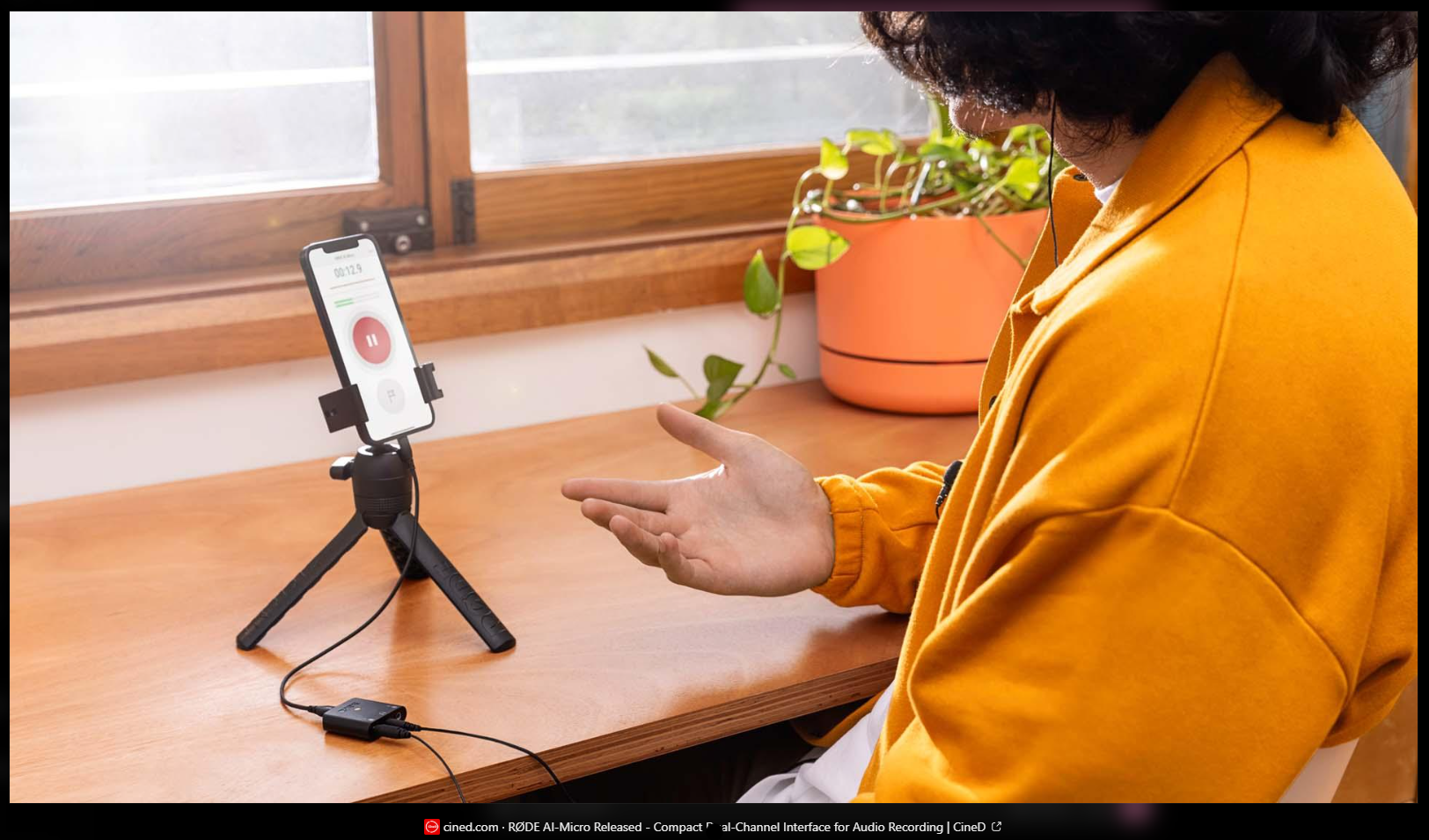 Screenshot of a mobile audio-recording setup with a phone on a tripod, shown as the CineD source image in a ChatGPT response.